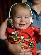 Toddler with headphones young music lover