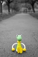 Lost crocodile toy on a road