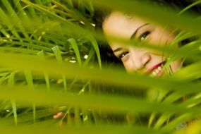 portrait of smiling girl in leaves