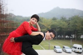 happy newlyweds on nature background