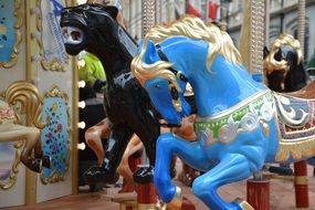 colorful carousel figures, horse and panther