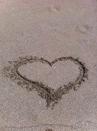 heart painted on the sand beach
