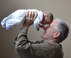 happy grandfather with a newborn