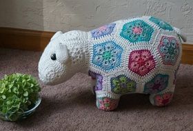 Colorful crocheted happy lamb