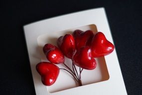 white card with red hearts