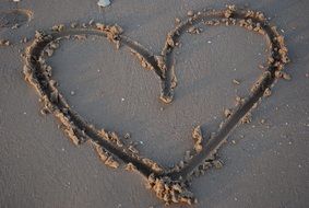 romantic heart on the beach sand