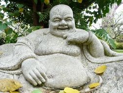 smiling buddha as garden decor