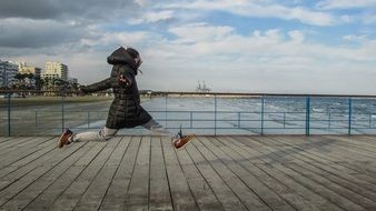 girl jumping for joy on the bridge