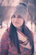 girl with long hair in winter hat