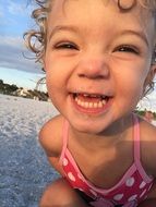 happy baby on the beach