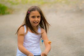 child on the playground in summer