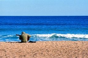 guitarist on an empty beach