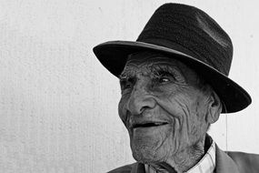 Black and white photo of the old smiling man