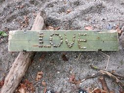 Love panel on sand