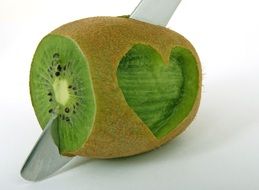 Cutting green kiwi