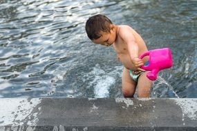 boy playing in swimming pool