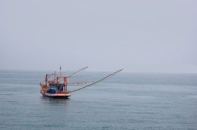 colorful fishing boat in calm sea