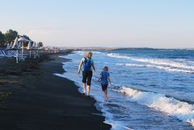 Mother and child Son Walking on Seacoast