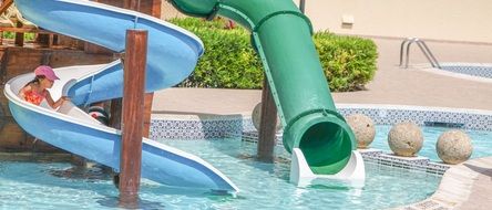 the child rolls down the water slides