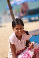 happy indian girl on the beach