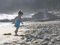 Baby on the beach near the ocean