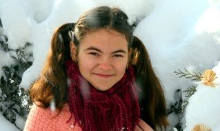 girl with a smile in the snow