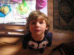child at the table with food