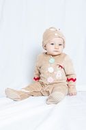little baby on a photo shoot in a white background