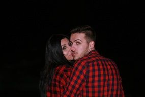 couple in love in black background