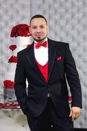 groom with red bow tie