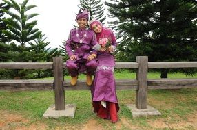 happy newlyweds in traditional national costumes