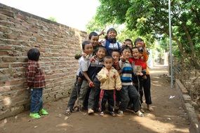 children walk near the wall