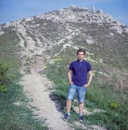 guy on mountain background photo