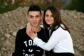romantic couple posing outdoors