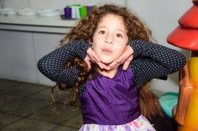 happy little girl with curly hair