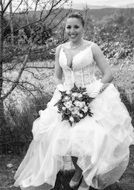 black and white photo of a happy bride among nature