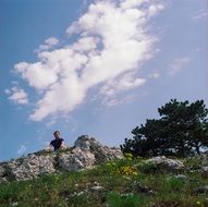 tourist on a stone hill
