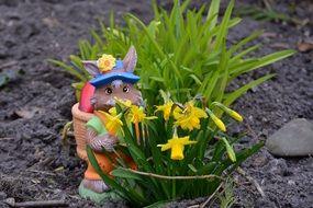 Easter bunny near a green plant