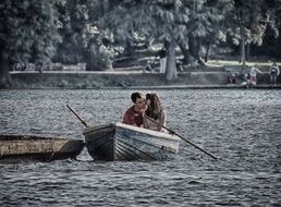 couple kissing in boat