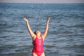 girl splashes water