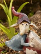 funny dwarf figure in the garden