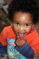 child with a long tongue