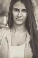 black and white photo of a beautiful girl with long hair