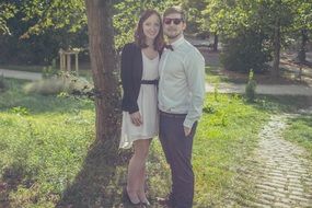 young couple in sunny park