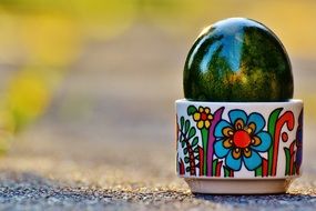bright green easter egg in stand