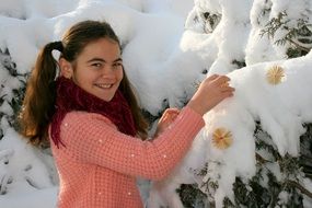 smiling girl near the snowy trees