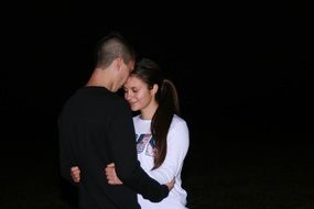 romantic couple in black background