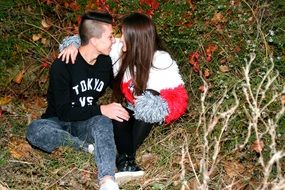 romantic couple among autumn foliage