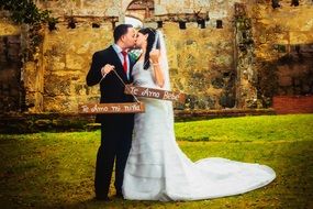 bride and groom at a photo shoot in the park