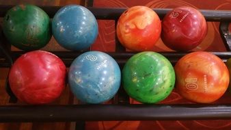 colorful bowling balls on the shelf